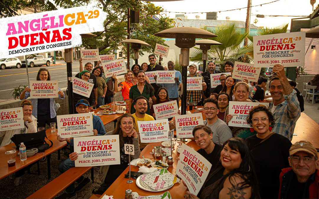 Angelica event with supporters holding signs
